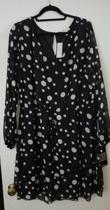 Black polka dot dress with ruffle skirt